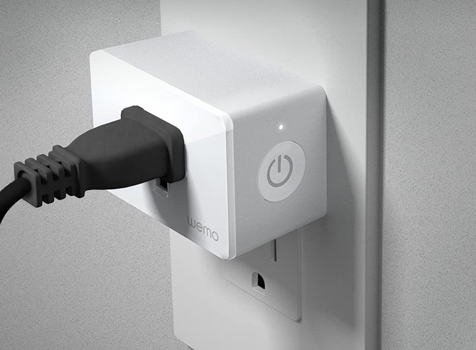 Wemo Smart Plug with a black cord plugged in. Shows that there's room for another device. 
