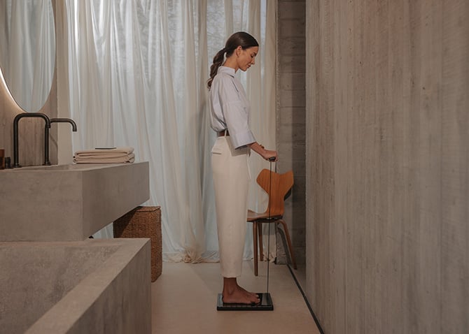 A woman using the Withing BodyScan 2