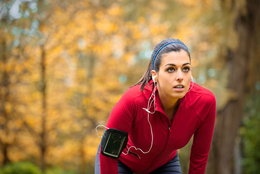 woman wearing in-ear headphones