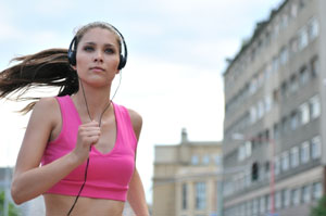 woman running w/ headphones