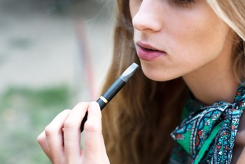 Woman smoking e-cigarette