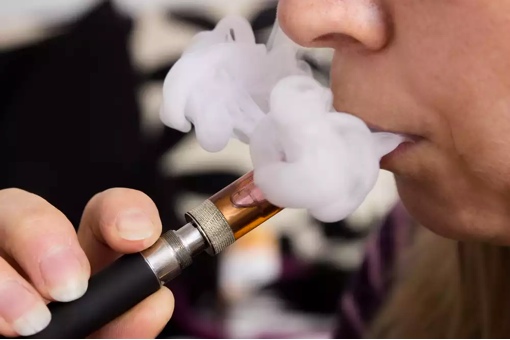 Woman smoking e-cigarette