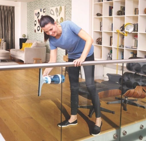 Woman using Black+Decker Powered Squeegee Vac