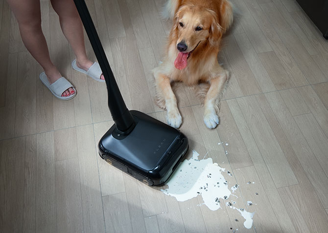 xLean with handle attached being used to clean up spilled milf