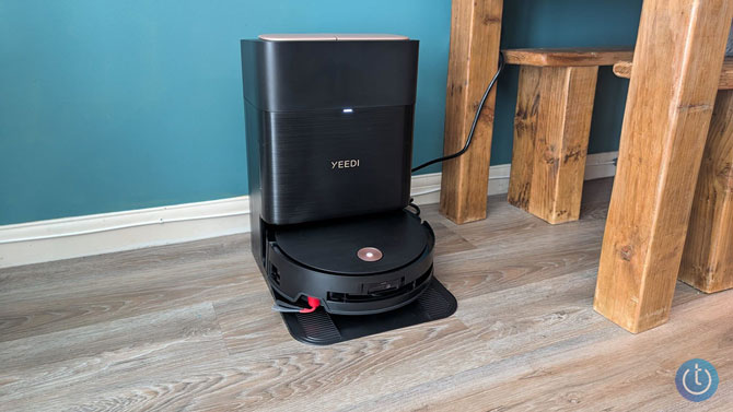 The Yeedi S16 Plus in its dock