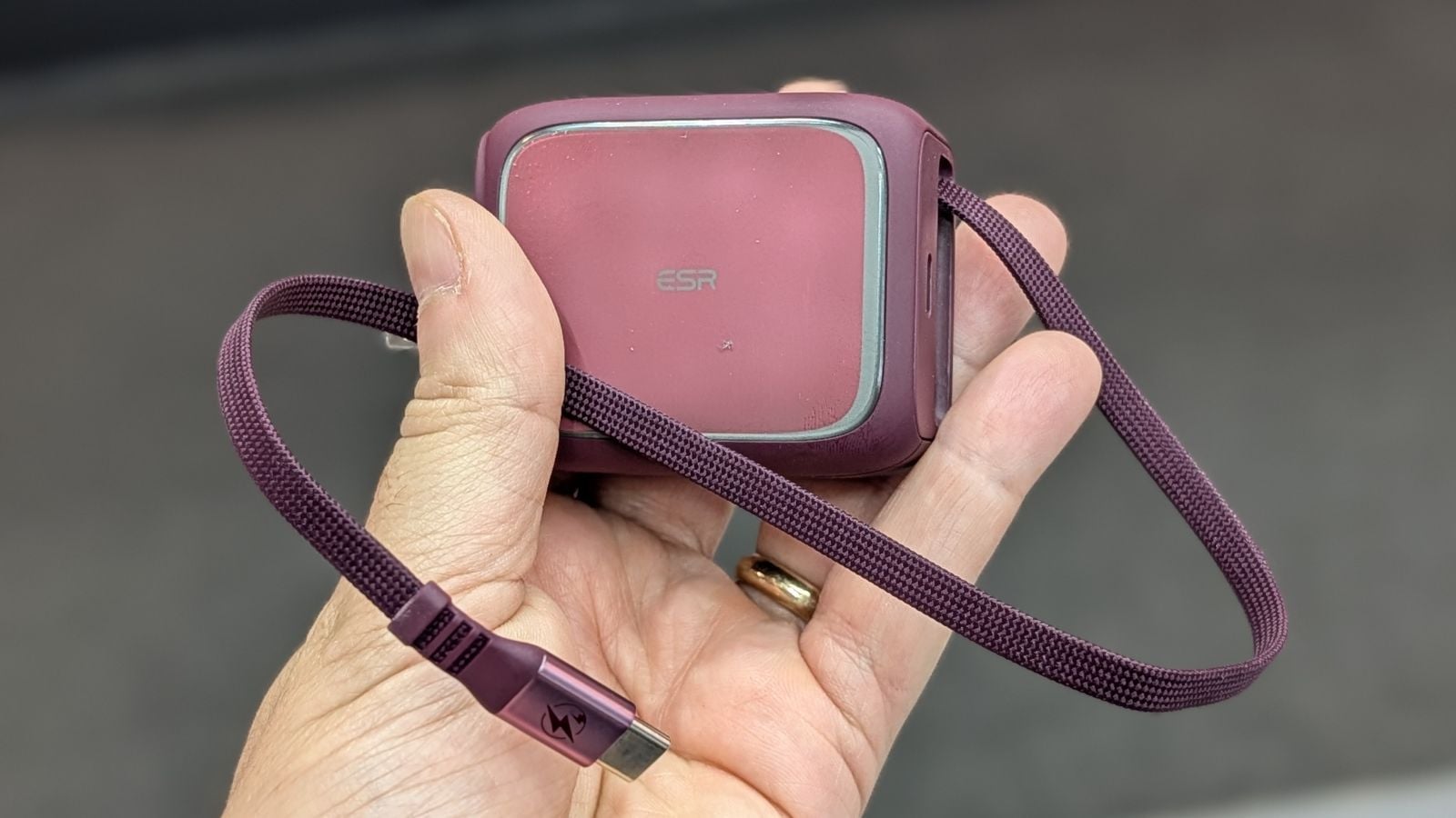 ESR Xtend 45W Retractable Charger in cherry red held in hand