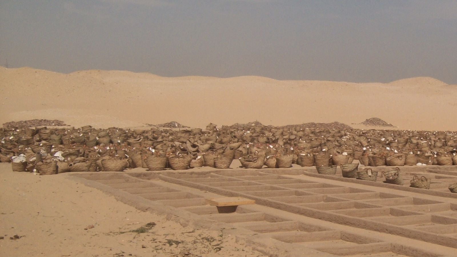 Excavated ancient tombs and burial structures at the Abydos necropolis in Egypt.