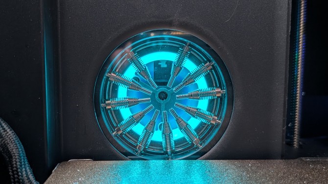 AtomForm 12 nozzle system with glowing blue light behind it