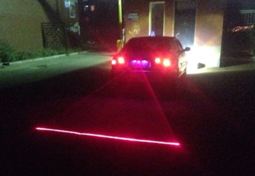 Car with rear-mounted safety laser