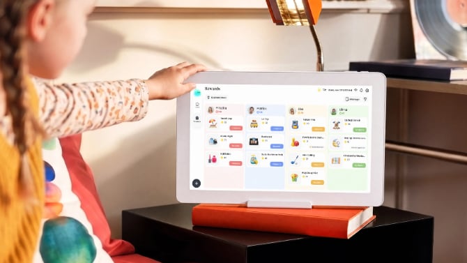 Cozyla Calendar Neo on a nightstand with a child reaching for it
