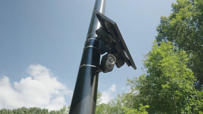 A Flock Safety license-plate reader mounted on a pole