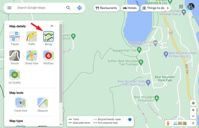 Google Maps screenshot showing Map details box with Transit, Traffic, Biking, Terrain, Street View ,Wildfires, Air Quality, and satellite options. Plus a legend box showing dark green for trails, lighter green for dedicated bike lanes, dotted green line for bicycle-friendly roads and brow for dirt/unpaved trails. At the top are options for searching for ATMs, Pharmacies, Parking, Transit, Attractions, Hotels, and Restaurants. 