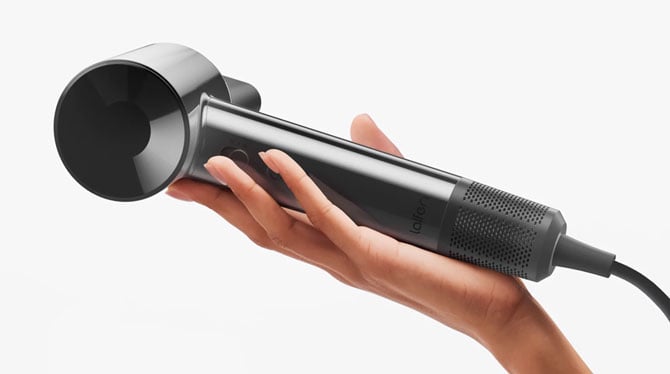 Laifen SWIFT SE hair dryer is shown held in a hand for scale.