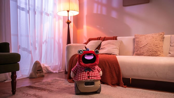 Ollobot OlloNi SS1 with cute red cover and red checked shirt, shown on wheeled base