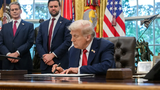 President Donald Trump signs proclamations and executive orders in the Oval Office