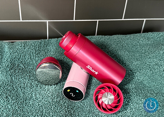 The SharkNinja ChillPill dispenses a cool mist. It's two other attachments are nearby, the cooling plate (on the left) and the fan (on the right).