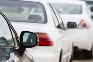 White cars parked on road