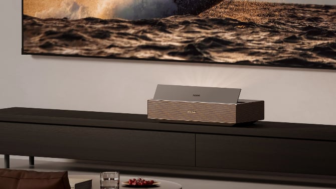 XGIMI Aura 3 Max at a TV table