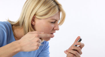 Angry woman with cell phone