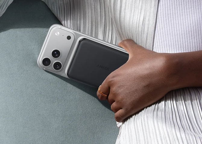 The Anker MagGo power bank attached to a phone.