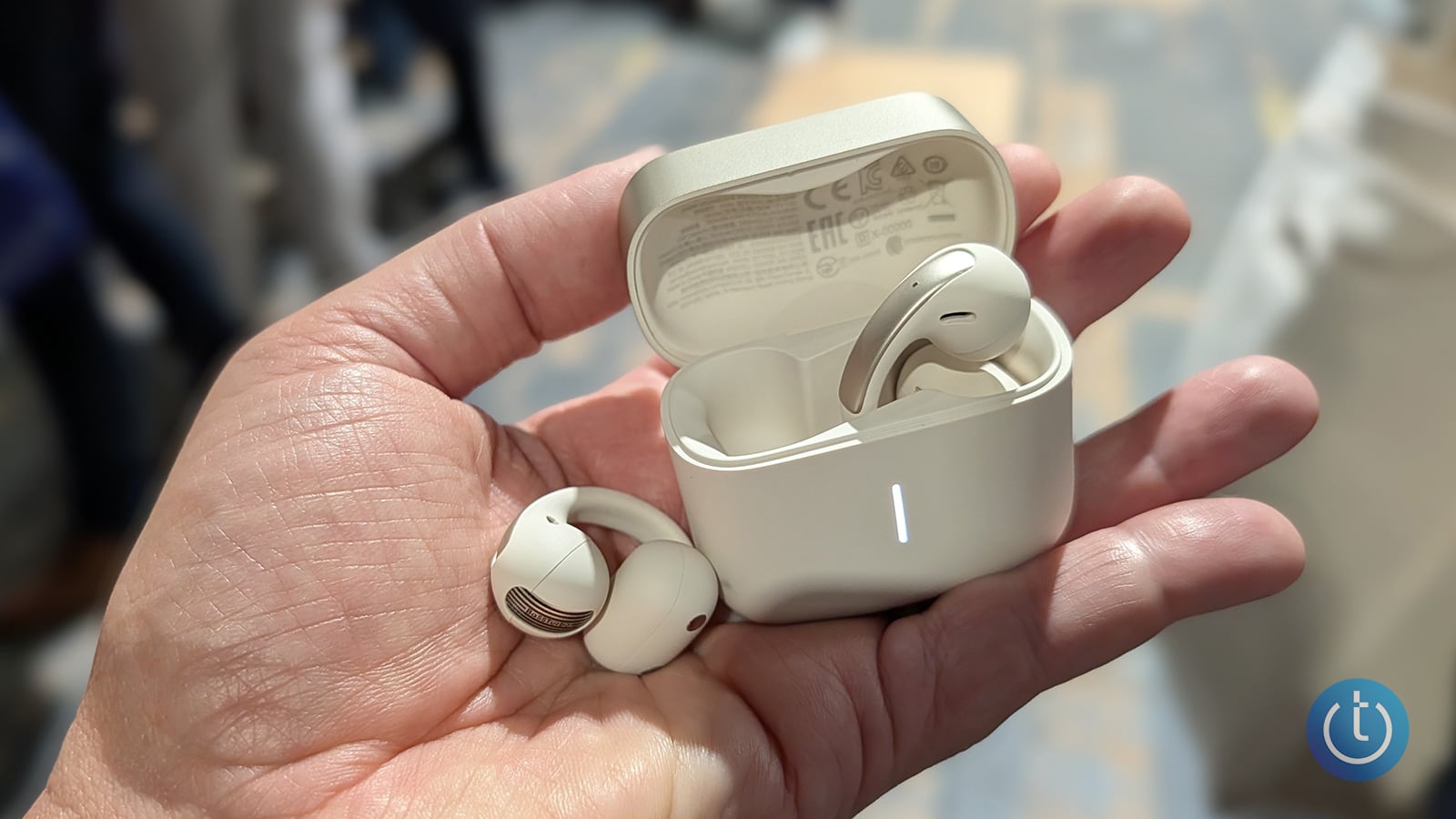 Anker Soundcore AeroClip 2 Pro open-ear AI note-taker earbuds shown with their case