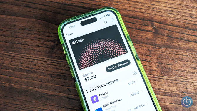 Apple Wallet app shown with Apple Cash card on iPhone 14 Pro