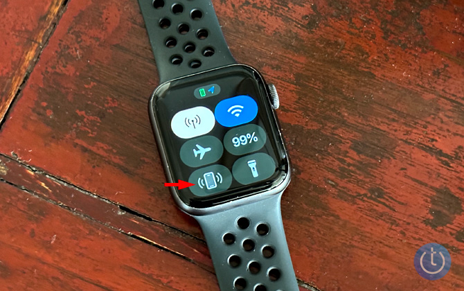 Apple Watch showing the quick settings screen with the ping iPhone button pointed out. 