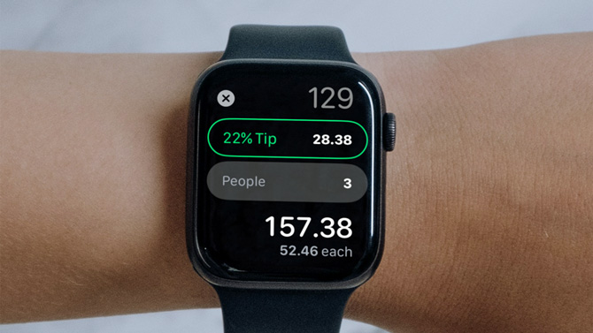 Apple Watch showing a tip calculated and divided between three people.