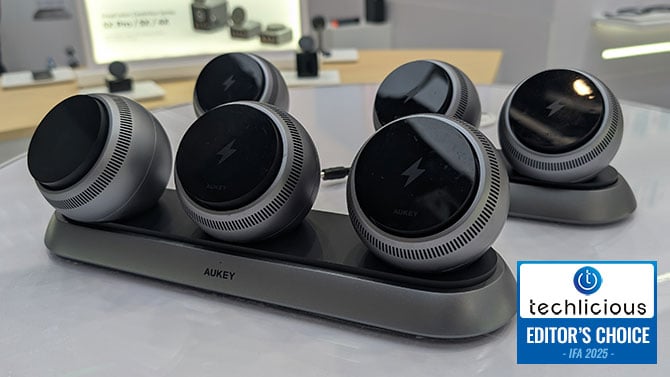 The AUKEY MagFusion ARK with three pods on the charging pad.The Techlicious Editor's Choice Award logo is in the lower right. 