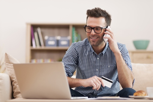 Man banking by phone