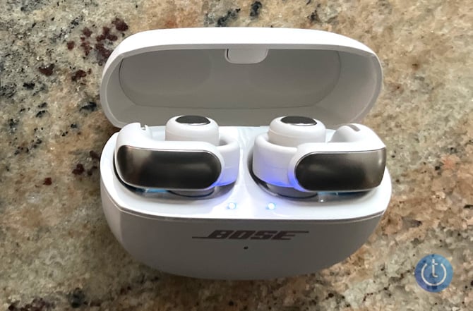 Bose Ultra Open Earbuds shown in their case.
