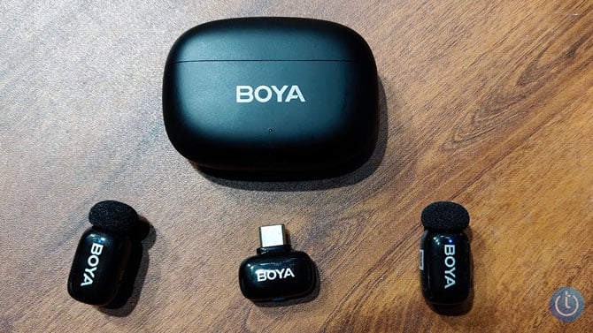 The Boya Mini 2 microphone system I tested has five components. There are two lavalier microphones, two receivers (one for USB-C and one for Lightning), and the charging case for the mics.