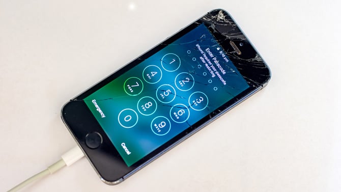Broken iPhone shown charging