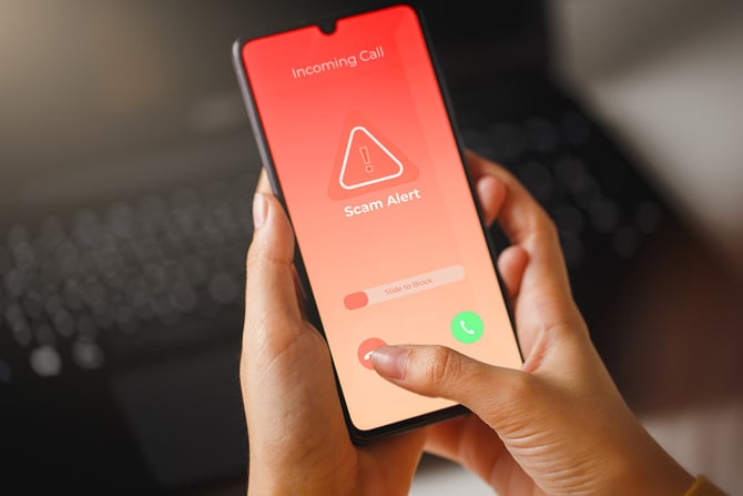 Smartphone showing an alert that the incoming call is a scam.