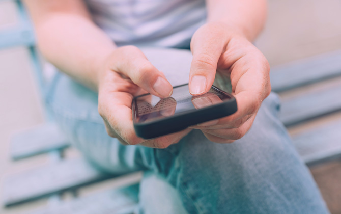 Closeup of hands using a phone