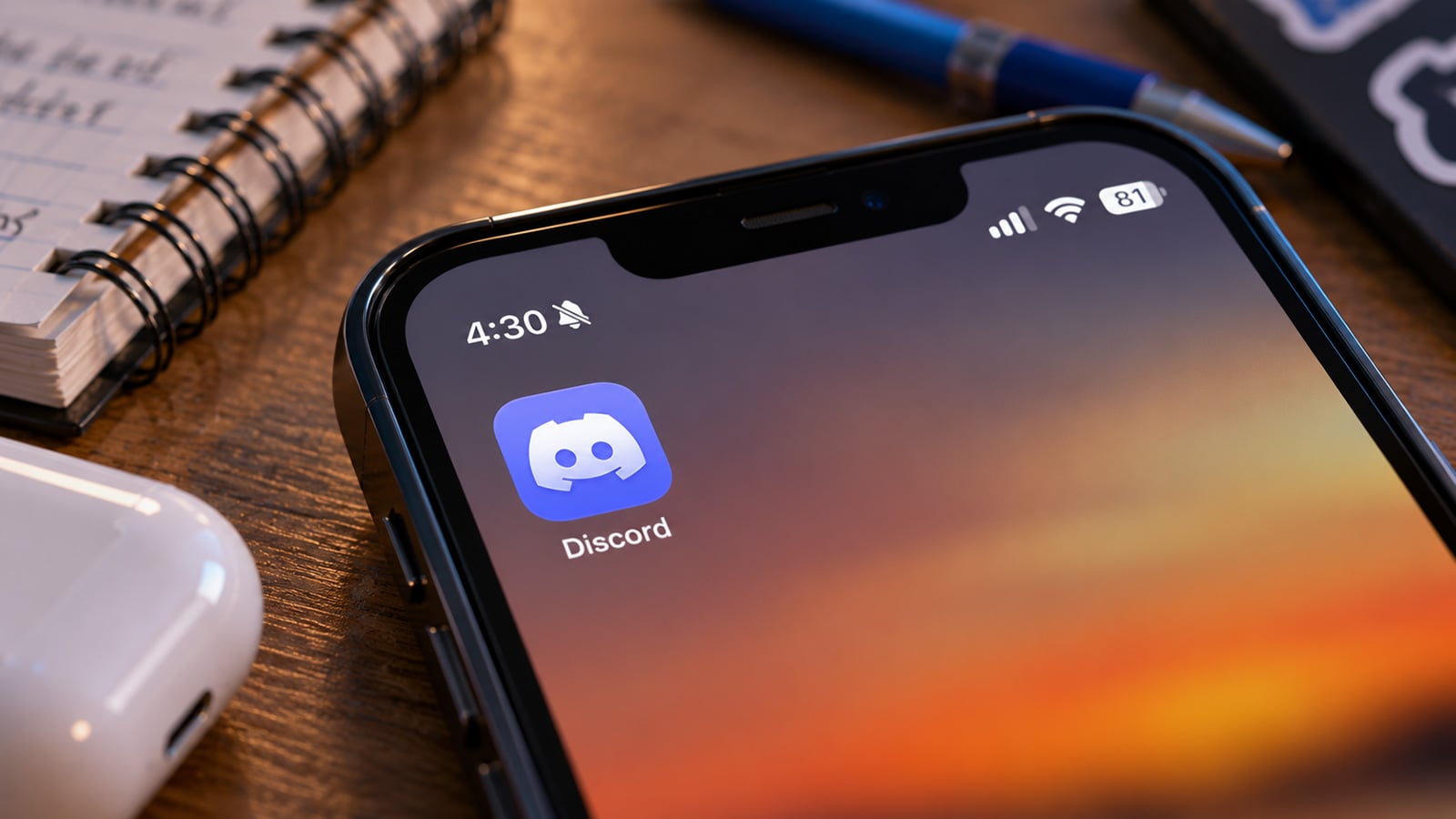 The Discord app icon is shown on an iPhone screen