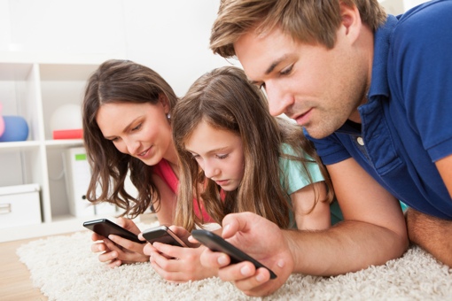 Family using smartphones