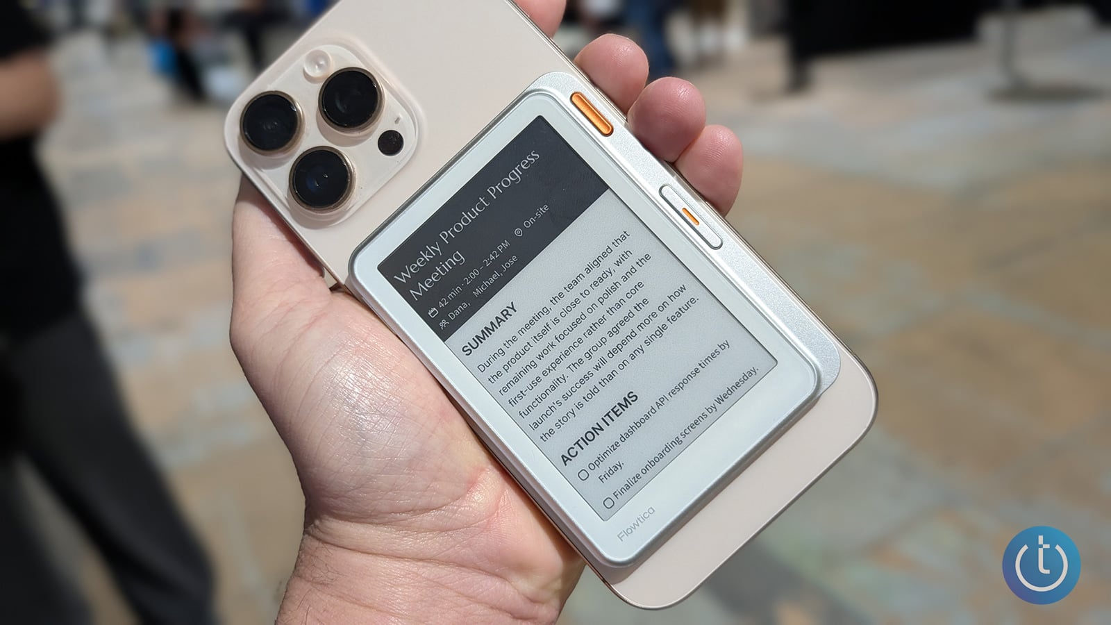 Flowtica Verso AI voice recorder is shown on the back of a phone.