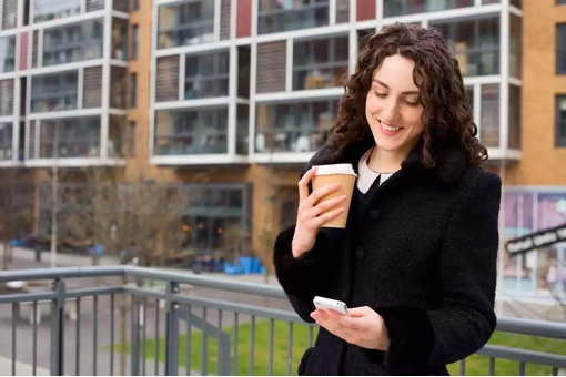 Happy woman on smartphone