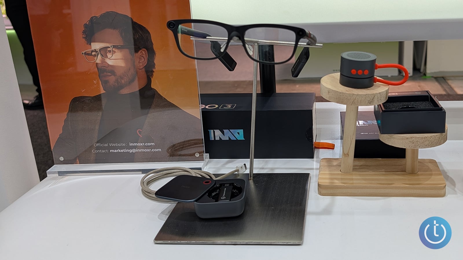 INMO GO3 AI glasses shown on a stand with the case below.
