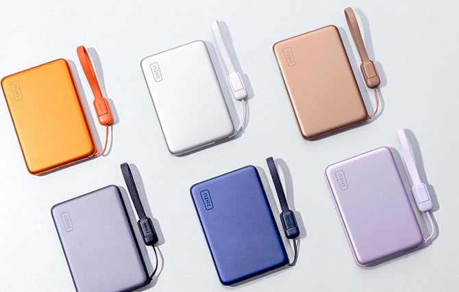The INIU SnapGo Air comes in (from the top left clockwise) orange, white, bronze, black, blue, and lavender.