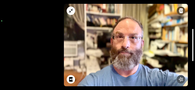 Screenshot of iOS 15 FaceTime app showing a man with a blurry home office background