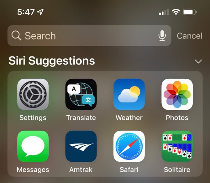 iOS 15 screenshot showing two lines of app icons in Spotlight search