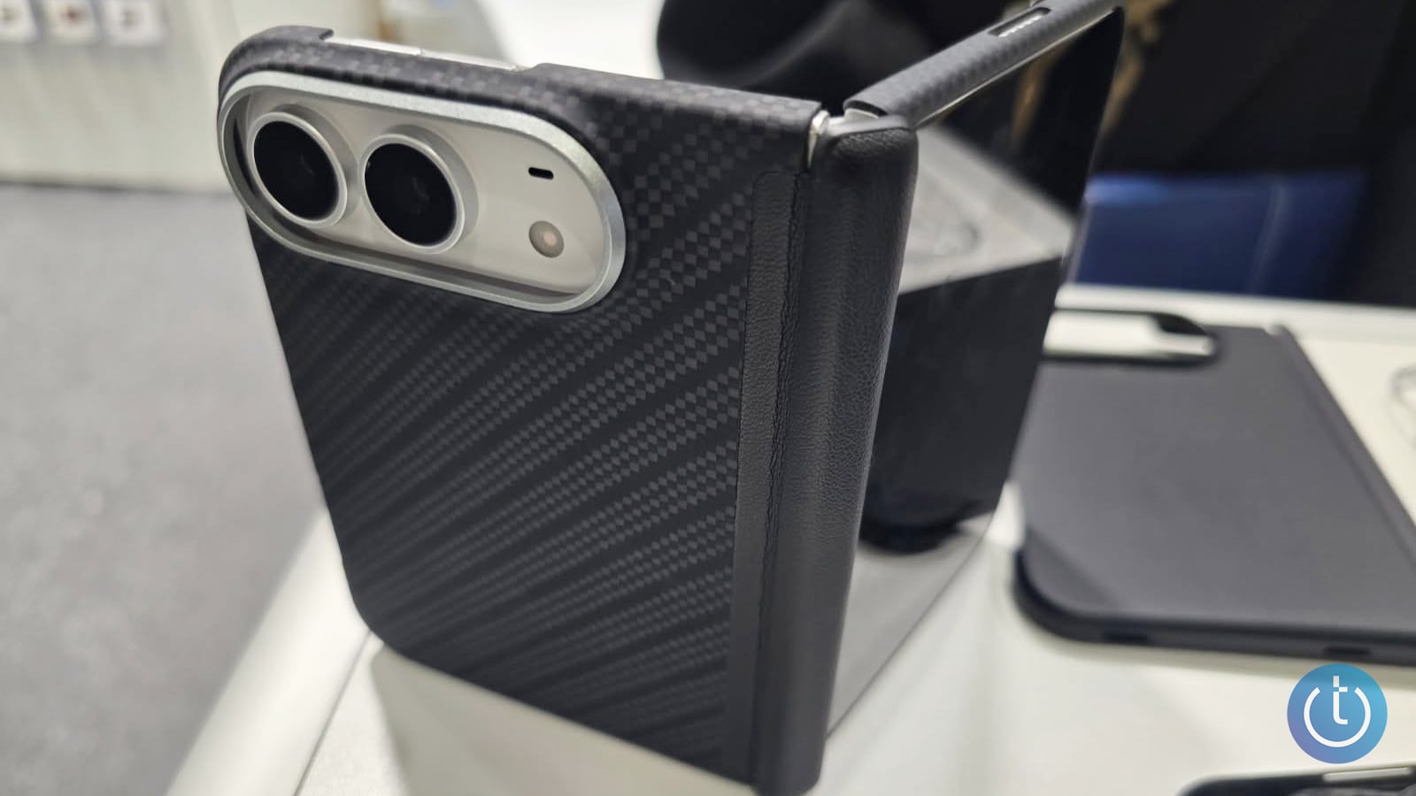 The back of the iPhone case shows a slot to hold two camera lenses.