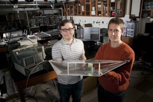 Katko and Hawkes hold a harvester cell