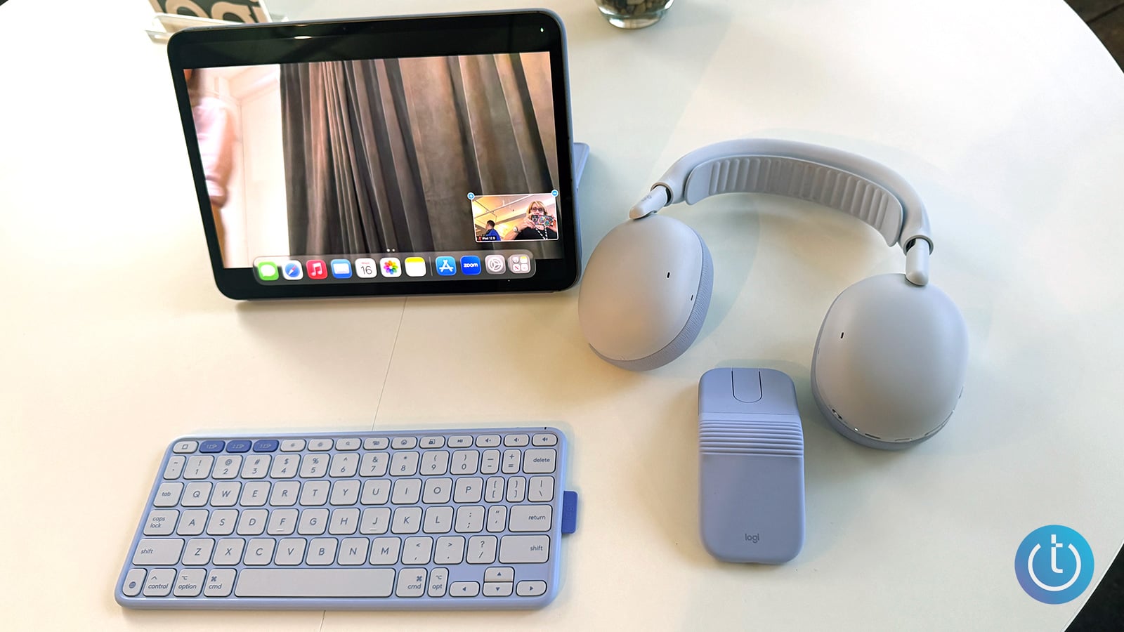 Logitech Zone Vibe Pro in lilac is shown with lilac Keys-To-Go 2 keyboard, lilac Mobi Fold mouse, and a lilac iPad case.