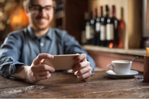 Man at restaurant on phone