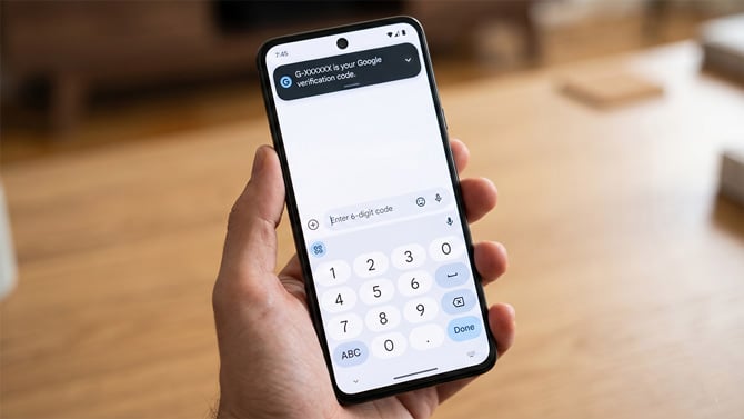 An Android phone shows a one-time passcode.
