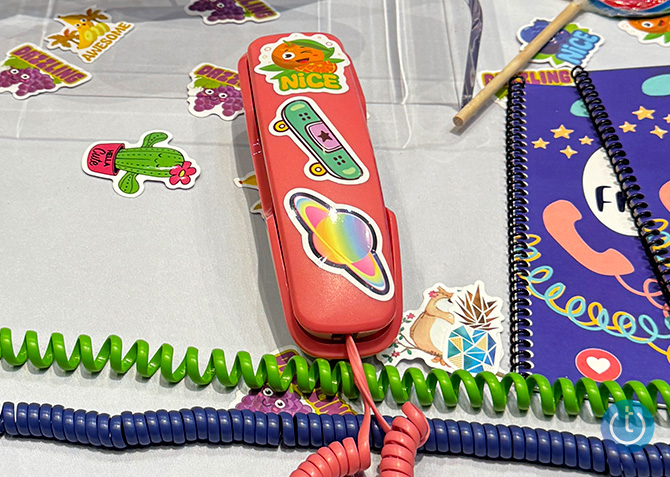 A basic Pinwheel Home phone in red