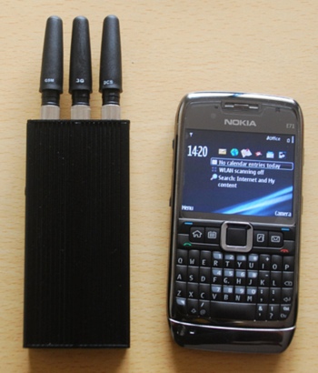 Illegal phone jammer next to a cellphone